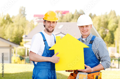 Workers with house model symbol