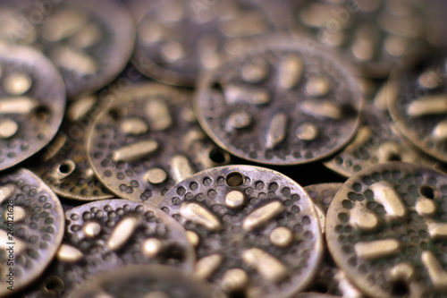 Vintage metal buttons. Old decorative metal design elements background.