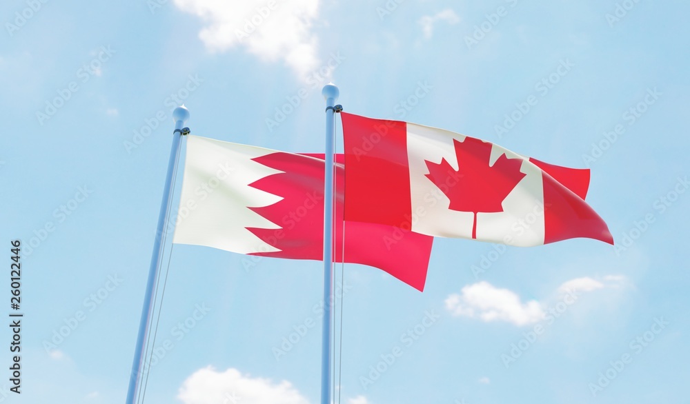 Canada and Bahrain, two flags waving against blue sky. 3d image