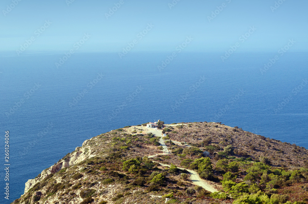House on the edge of a cliff overlooking the Aegean sea, Rhodes. House on the edge of a cliff overlooking the Aegean sea, Rhodes.