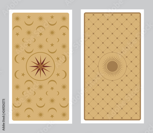 Back of Tarot card decorated with stars, sun and moon