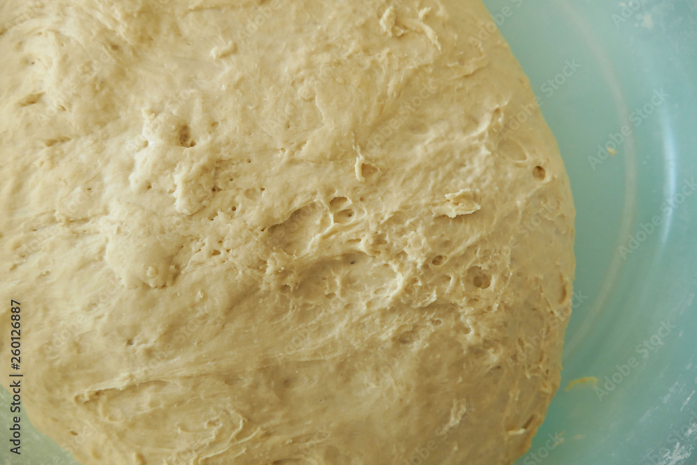 a large amount of fermented dough in the container, a large amount of fermented dough in the container,