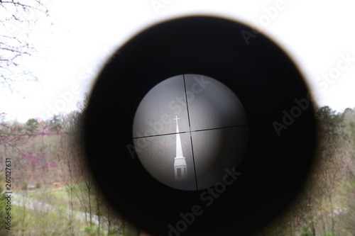 church seen through rifle scope