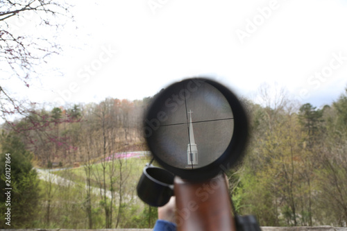 church seen through rifle scope