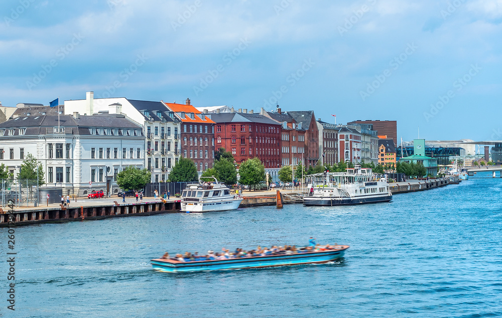 Tour boat Copenhagen harbor skyline