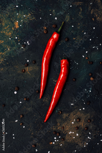 Red pepper on black background.Spicy.Food concept.Top view.Vegetable menu.To describe spicy dishes.Hot offer.Сhili flat lay.Mexican food