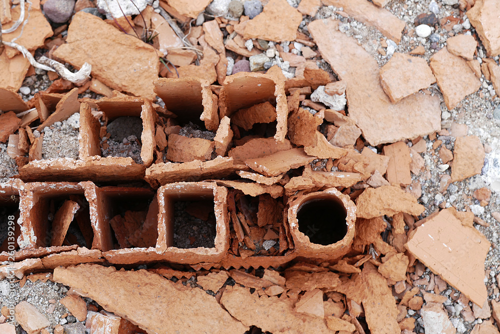 rotten concrete and bricks, use of poor quality materials in construction,