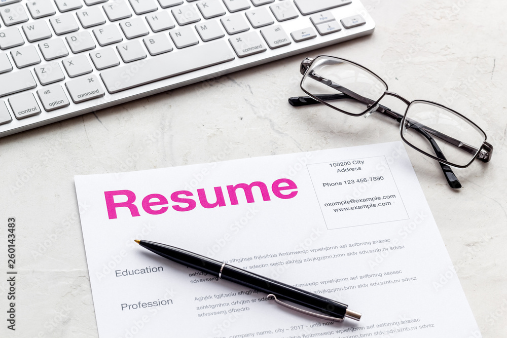 Create CV concept with pen, glasses, keyboard on white desk top view Create CV concept with pen, glasses, keyboard on white desk top view
