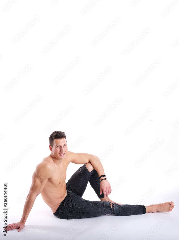 Nice, young adult man posing in a studio. Nice, young adult man posing in a studio.