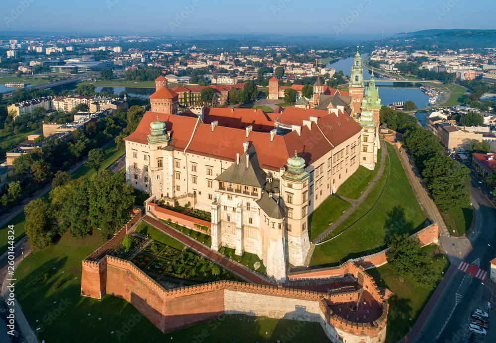 Historic royal Wawel castle and cathedral in Cracow, Poland.  Aerial view in sunrise light early in the morning - obrazy, fototapety, plakaty 