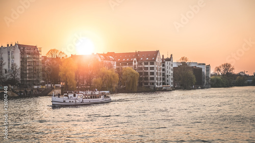 boat on river spree in Berlin during sunset
