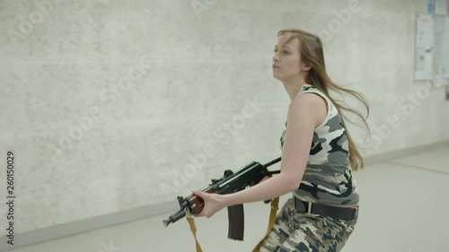 Wallpaper Mural Slow Motion - Young Girl Running Aiming AK-74-SU Torontodigital.ca