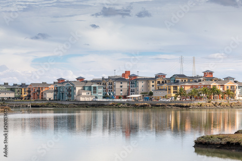 A Waterfront Community Reflected on the Bay in Late Afternoon Sunlight