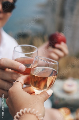 couple toasting with glasses of wine