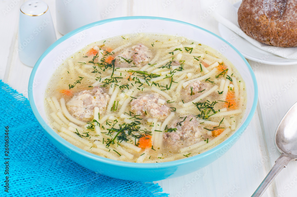 Delicious broth with meatballs and pasta. Delicious broth with meatballs and pasta.