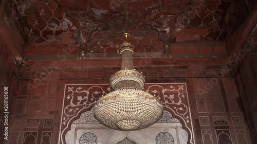 a tilt up shot of a chandelier at jama masjid mosque in delhi, india photo