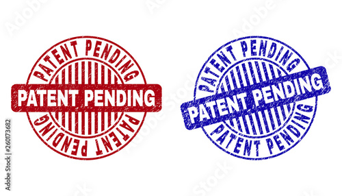 Grunge PATENT PENDING round stamp seals isolated on a white background. Round seals with grunge texture in red and blue colors.