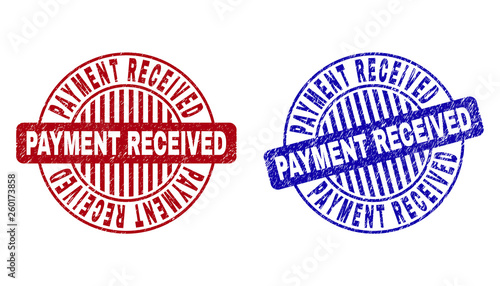 Grunge PAYMENT RECEIVED round stamp seals isolated on a white background. Round seals with grunge texture in red and blue colors.