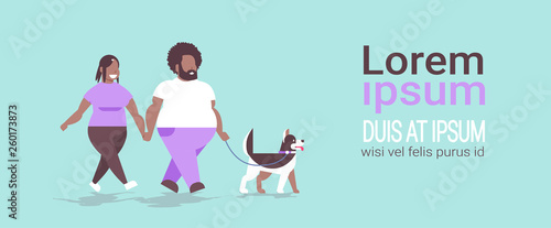 fat obese couple walking with husky dog african american overweight man woman having fun obesity concept horizontal full length flat copy space