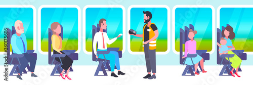 inspector man selling tickets to passengers sitting in train compartment during vacation trip ticket validation concept railway transport traveling flat full length horizontal