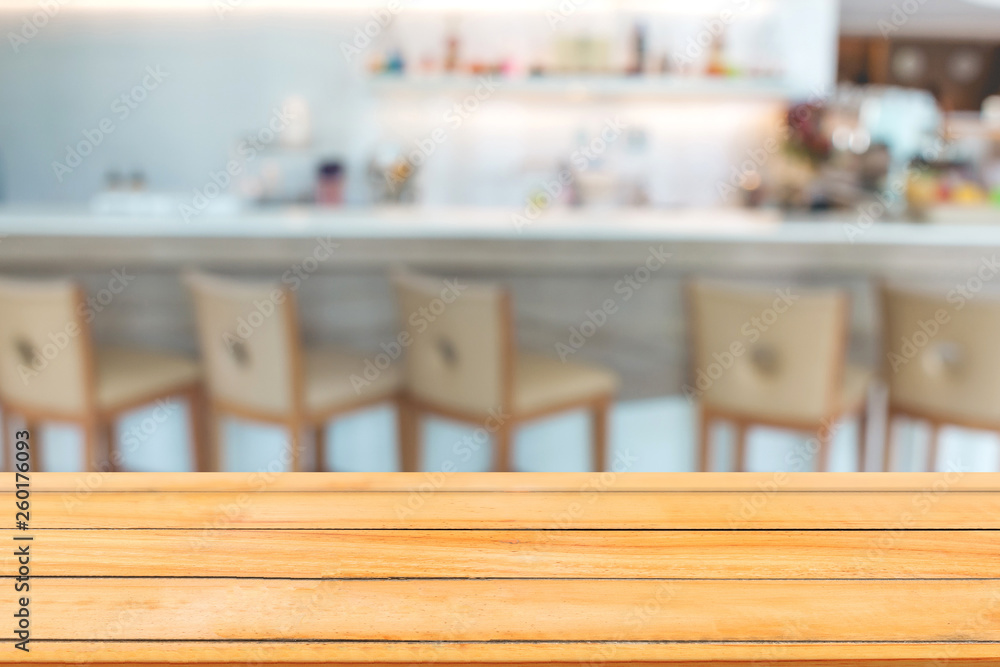 Abstract image of Empty wooden table with blurred coffee cafe. Abstract image of Empty wooden table with blurred coffee cafe.