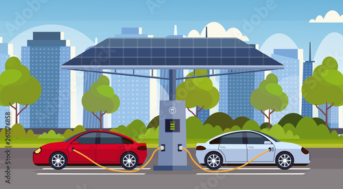 Fototapeta Naklejka Na Ścianę i Meble -  electric cars charging on electrical charge station with solar panels renewable eco friendly transport environment care concept flat modern cityscape background horizontal