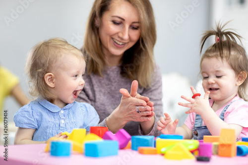 Woman teaches children mode...