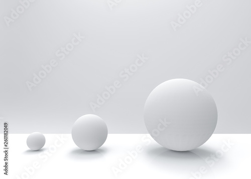 3d rendering. simple white small to big sphere ball object on gray backgorund. growing up or evolution concept. © PATARA