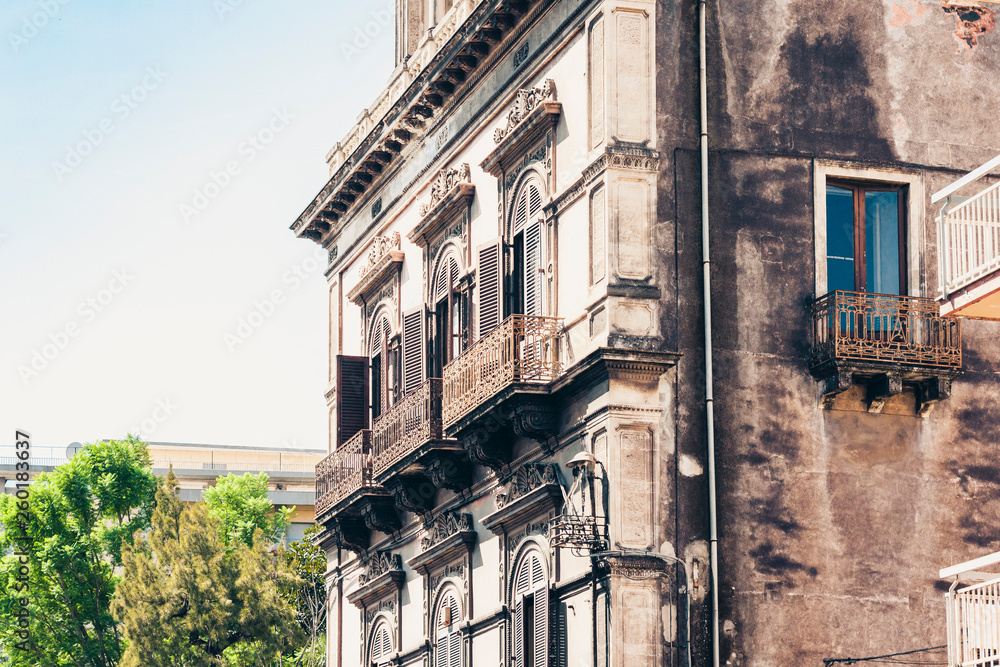 Fototapeta premium balcony in old baroque building in Catania, traditional architecture of Sicily, Italy.
