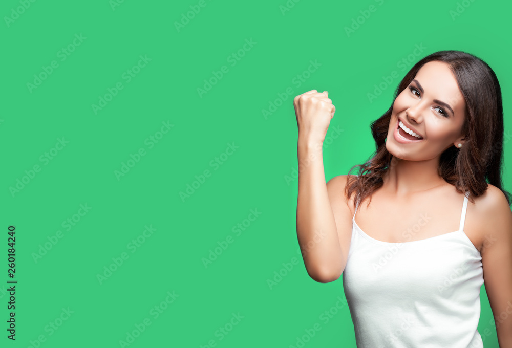 Happy gesturing young woman, over blue Happy gesturing young woman, over blue