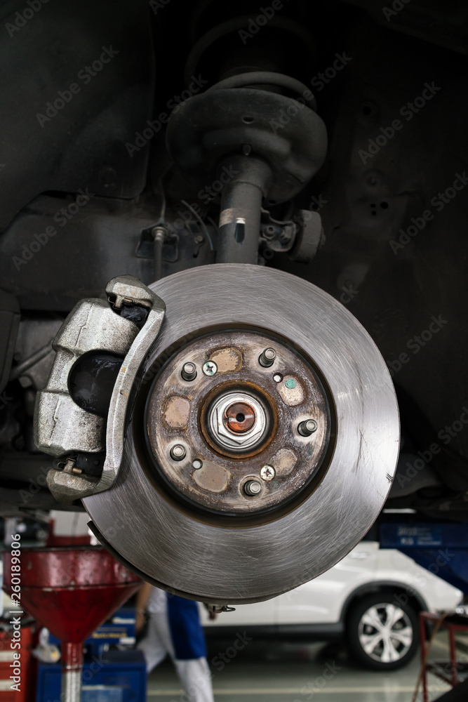 disc brake of modern car to be fixed at garage, shallow depth of field