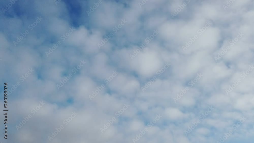 Alto cumulus clouds in timelapse in fast motion until blue summer sky Alto cumulus clouds in timelapse in fast motion until blue summer sky