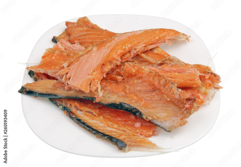 Hot smoked salmon trim and leftovers with bones and fins low cost delicacy on plate isolated Hot smoked salmon trim and leftovers with bones and fins low cost delicacy on plate isolated