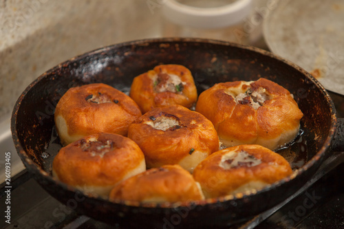 Meat pies, pan-fried in boiling oil.