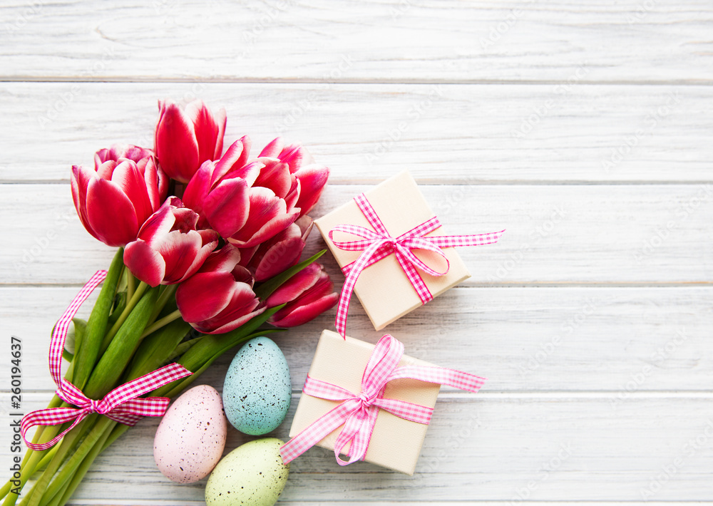 Gift boxes, easter eggs and tulips bouquet Gift boxes, easter eggs and tulips bouquet