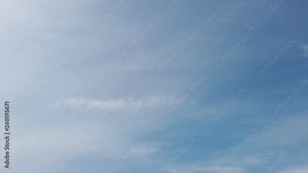 Summer time lapse clouds, with white soft filaments of blurred cirrus clouds in blue sky Summer time lapse clouds, with white soft filaments of blurred cirrus clouds in blue sky