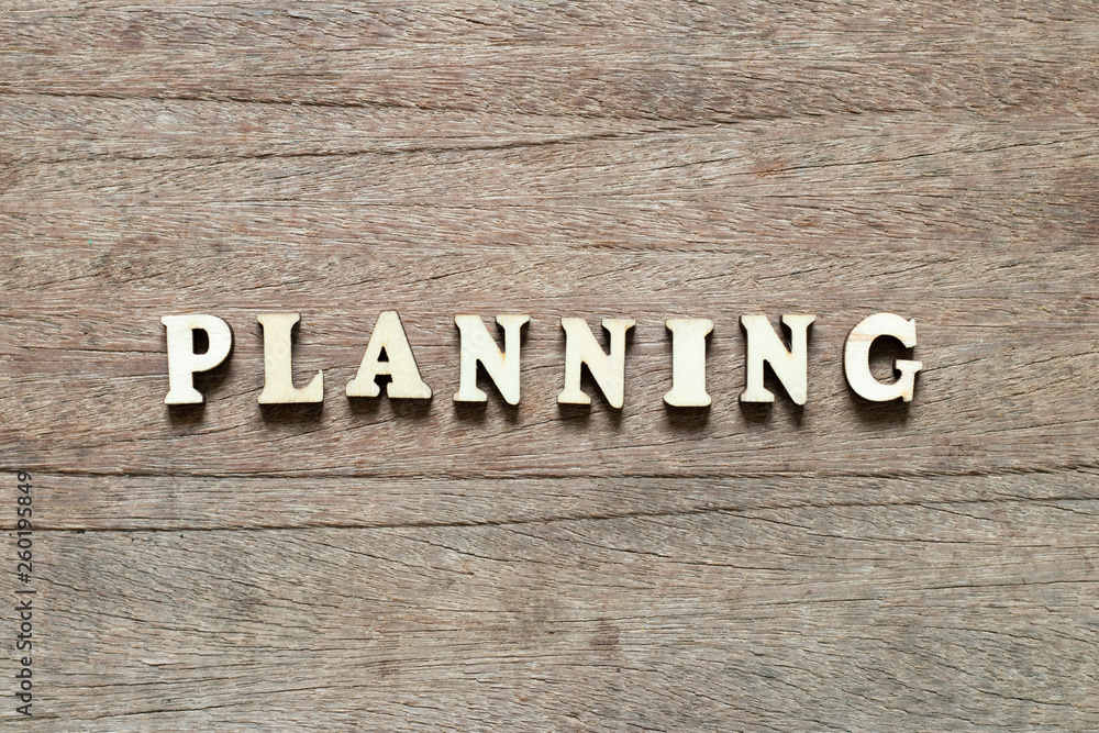 Letter block in word planning on wood background Letter block in word planning on wood background