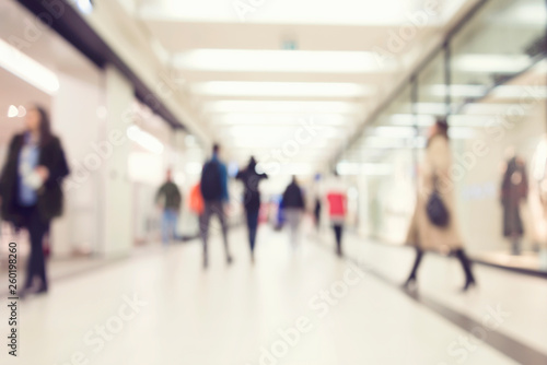 Blurred image of people in shopping mall with bokeh, vintage color