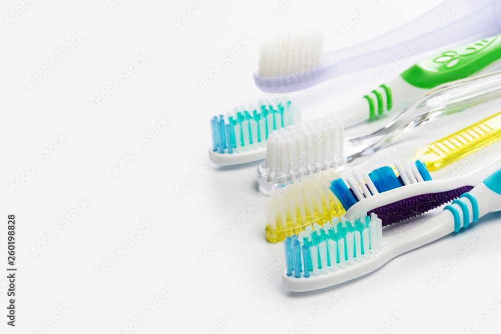 New different toothbrushes on a white background New different toothbrushes on a white background