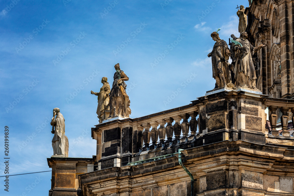 The architecture of the old town in Dresden on the background of bright blue sky. Close-up.