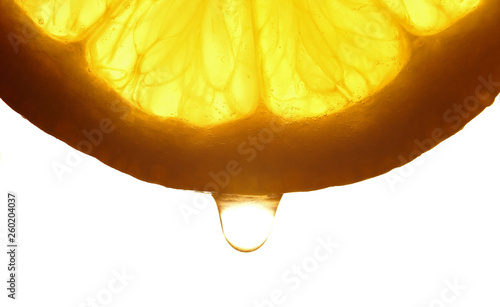 Lemon slice with a water droppings. Macro studio shot