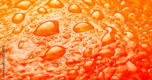 Ripe Orange Background texture with waterdrops macro studio shot