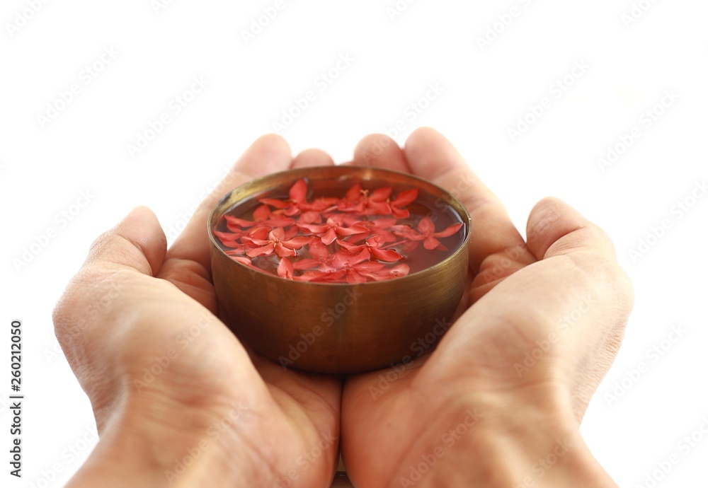 Thai Songkran festival - Brass bowl put on hands isolated on white Thai Songkran festival - Brass bowl put on hands isolated on white