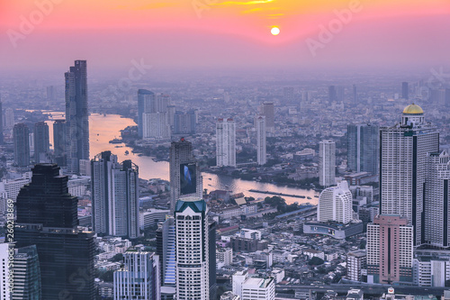View of Bangkok skyline and skyscraper Panorama over Chao Phraya River Bangkok Thailand at sunset. © Camille