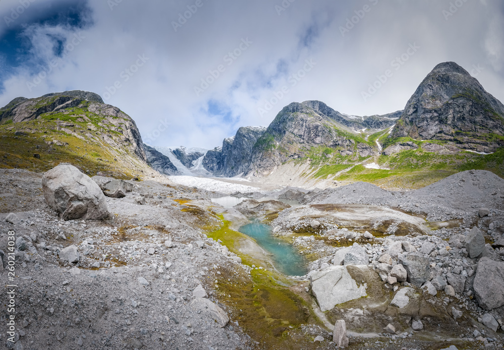 Vibrant colors in the Austerdalbreen valley with giant glacier in mountain scenery Norway Vibrant colors in the Austerdalbreen valley with giant glacier in mountain scenery Norway