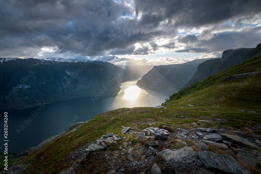 Beautiful sun beam in the Aurlandfjord from Prest viewpoint in stunning mountain scenery Norway