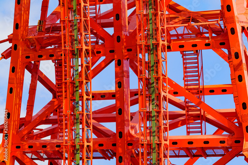 Close up of red metal construction of Zhivopisny Bridge (Picturesque bridge) on blue sky background in Moscow, Russia
