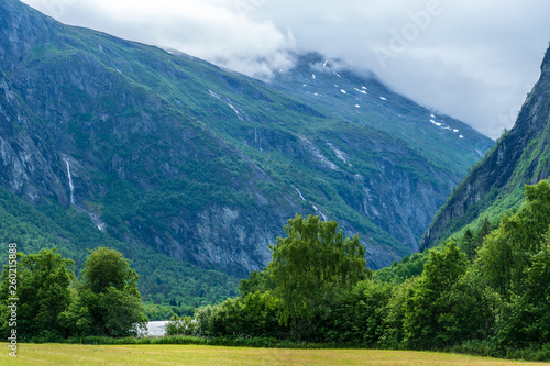 Green valley between large mountains in Norway