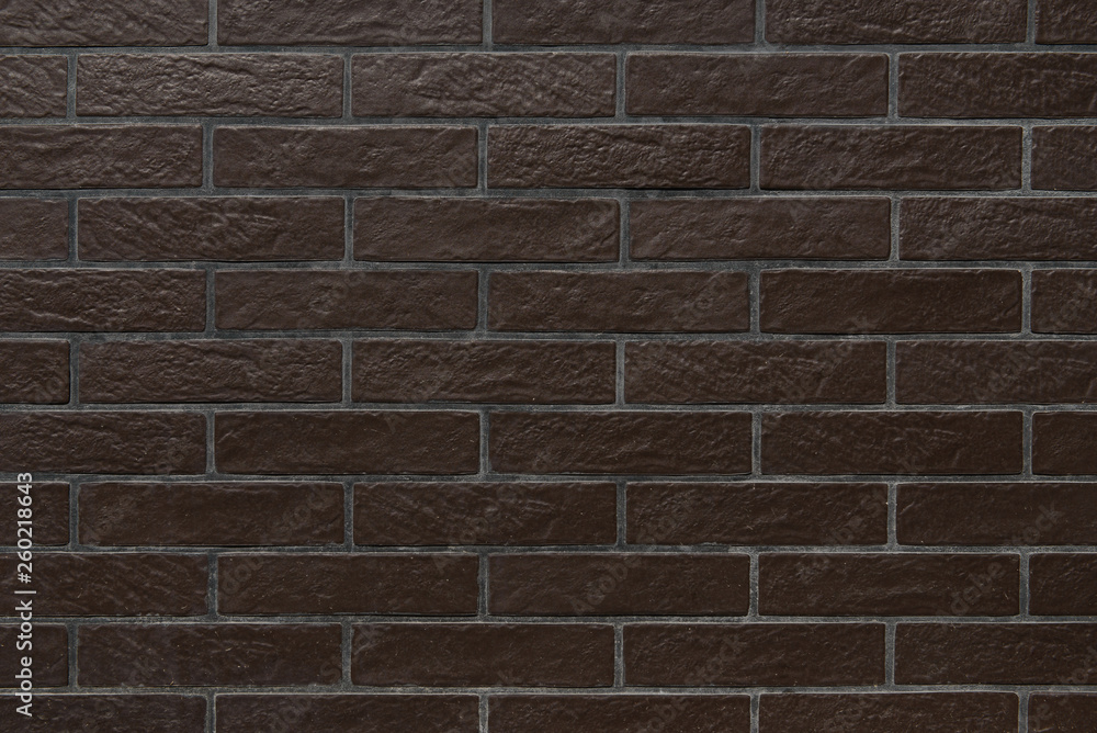 Fototapeta premium glossy brown brick wall