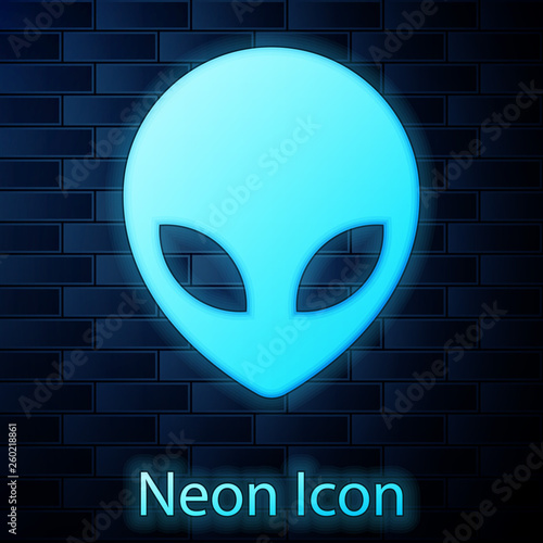 Glowing neon Alien icon isolated on brick wall background. Extraterrestrial alien face or head symbol. Vector Illustration